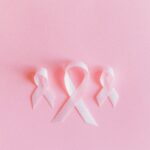Pink breast cancer ribbons on pink background
